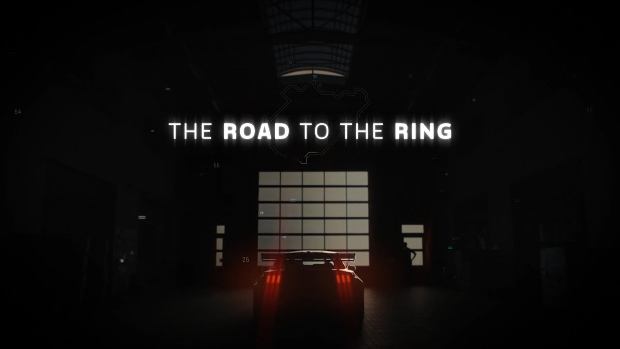 Une Ford Mustang GTD dans un garage de course avec « THE ROAD TO THE RING »